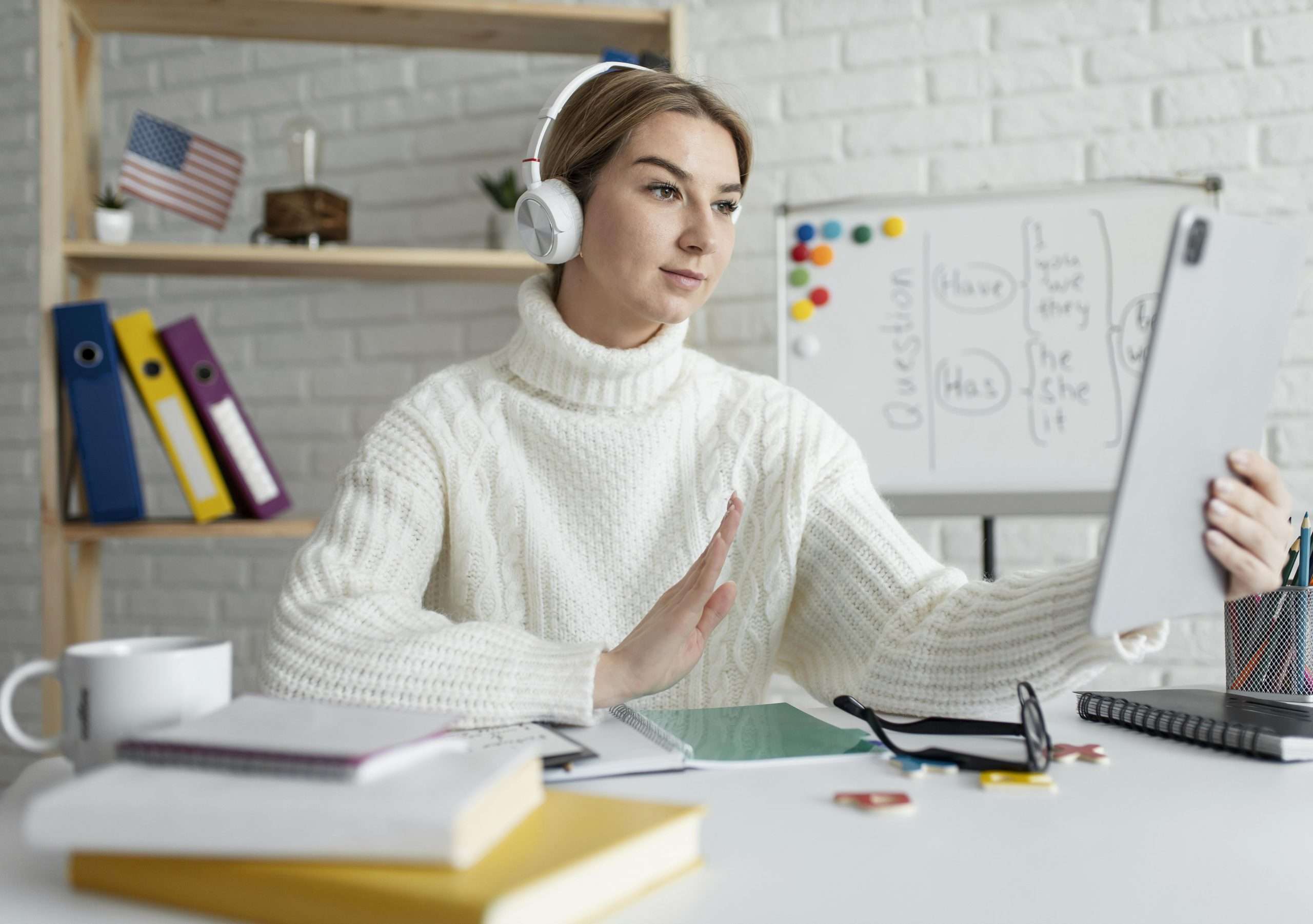 young woman teaching kids english lesson online scaled
